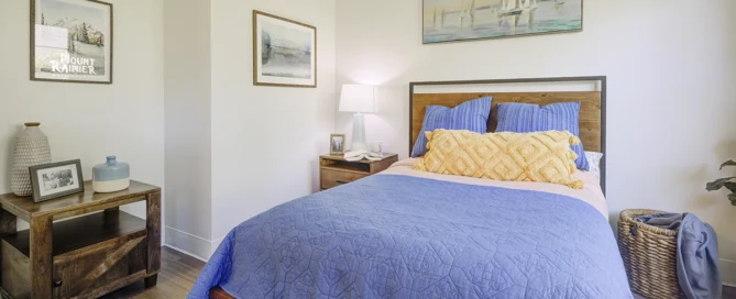 A cozy, personalized assisted living apartment with natural light, family photos, and soft décor at The Sequoia Senior Living in Olympia, WA