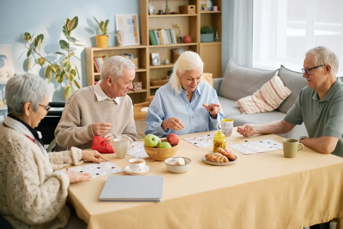 Group of elderly people enjoying breakfast together, reflecting the social connection and daily support available through respite care in Olympia families can use for short-term caregiver relief.